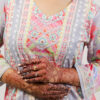 Woman in colorful chikankari kurti set, showcasing affordable and sustainable Indian ethnic fashion.