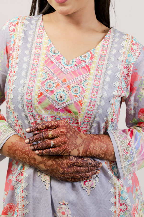 Woman in colorful chikankari kurti set, showcasing affordable and sustainable Indian ethnic fashion.